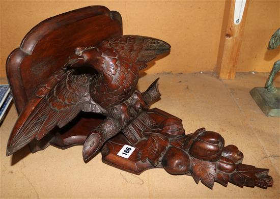 Carved oak clock bracket